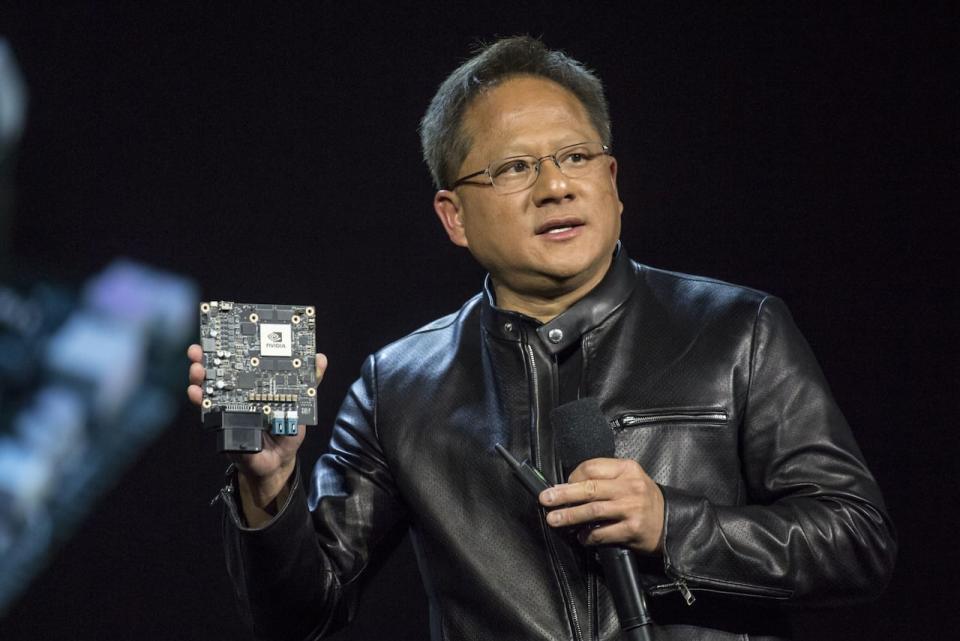 Jensen Huang, CEO of Nvidia, holds up one of the company's high-end modules at the 2017 CES show in Las Vegas. Products like this are proving critical to artificial intelligence systems around the world. (David Paul Morris/Bloomberg - image credit)