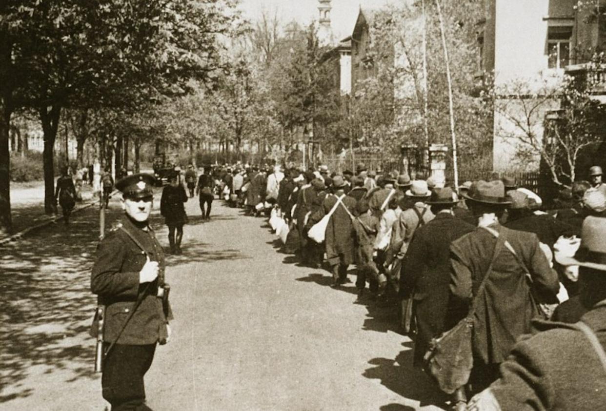 Jewish deportees march through the German town of Würzburg to the railroad station on April 25, 1942. <a href="https://collections.ushmm.org/search/catalog/pa6232" rel="nofollow noopener" target="_blank" data-ylk="slk:US Holocaust Memorial Museum, courtesy of National Archives and Records Administration;elm:context_link;itc:0;sec:content-canvas" class="link ">US Holocaust Memorial Museum, courtesy of National Archives and Records Administration</a>