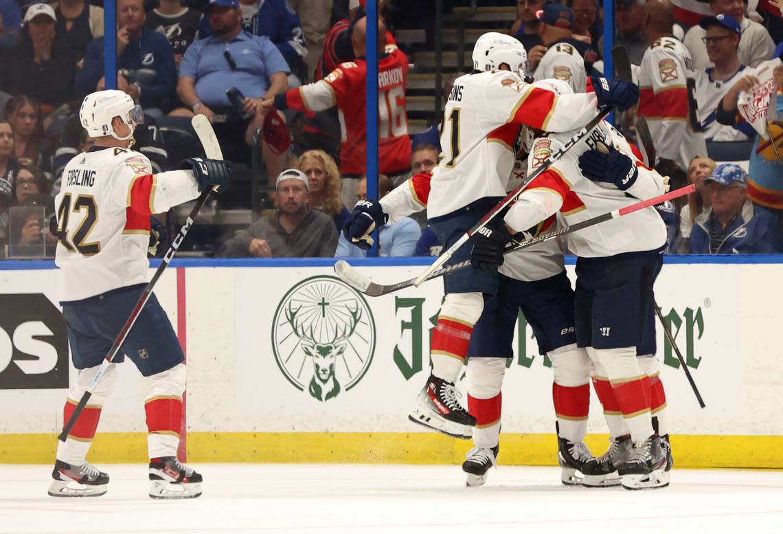Apr 25, 2024; Tampa, Florida, USA; Florida Panthers center Steven Lorentz (18) is congratulated by defenseman Gustav Forsling (42), center Nick Cousins (21), right wing Kyle Okposo (8) and defenseman Aaron Ekblad (5) after he scored a goal against the Tampa Bay Lightning during the third period in game three of the first round of the 2024 Stanley Cup Playoffs at Amalie Arena. Mandatory Credit: Kim Klement Neitzel-USA TODAY Sports Kim Klement Neitzel/USA TODAY Sports