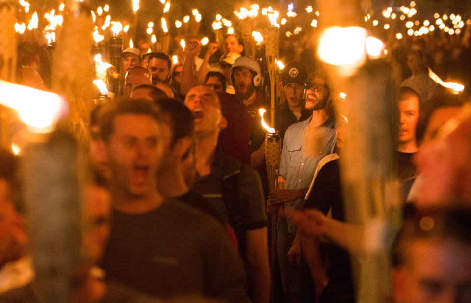 White supremacists march through the University of Virginia campus in Charlottesville on Aug. 11, 2017, the night before holding a violent "Unite The Right" rally. (Photo: NurPhoto via Getty Images)