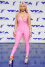 <p>Minaj wore a bubblegum-pink latex jumpsuit to the MTV Video Music Awards in late August. (Photo: Getty Images) </p>