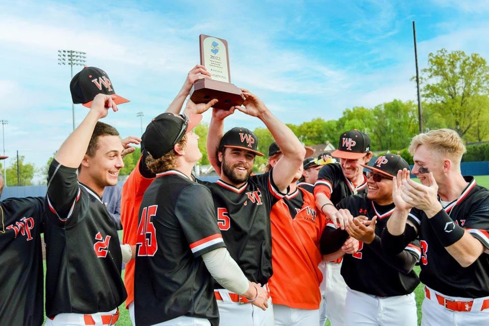 Senior Dan Carter, center, and the William Paterson University baseball team celebrate after defeating Kean to win the NJAC title on May 10, 2022.