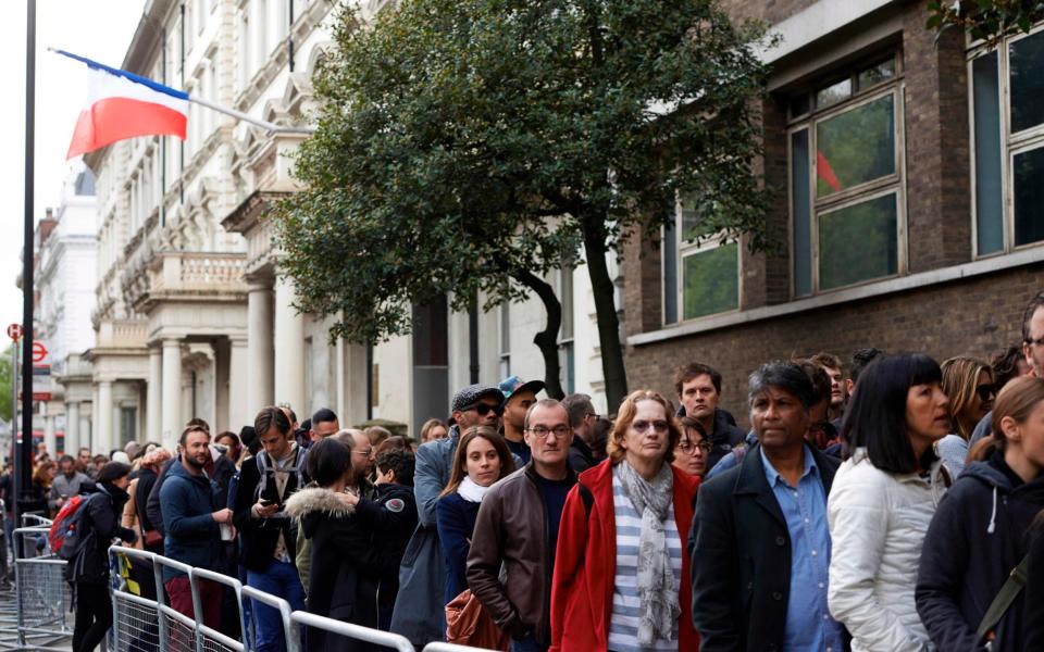 French nationals in long queues outside the Lycee Francais Charles de Gaulle in London - Credit: AFP