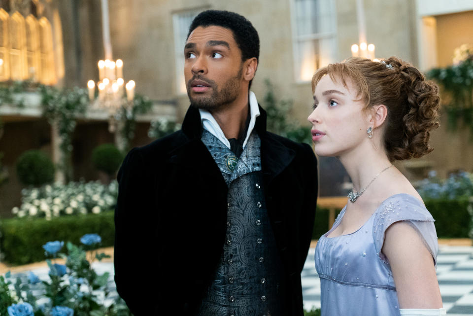 Regé-Jean Page, as Simon, and Phoebe Dynevor, as Daphne, in a scene from 