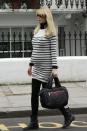 <p>Claudia Schiffer's horizontal stripes minimize the size of her bump while the model lets her bump breathe in a stretchy sweater dress.</p>