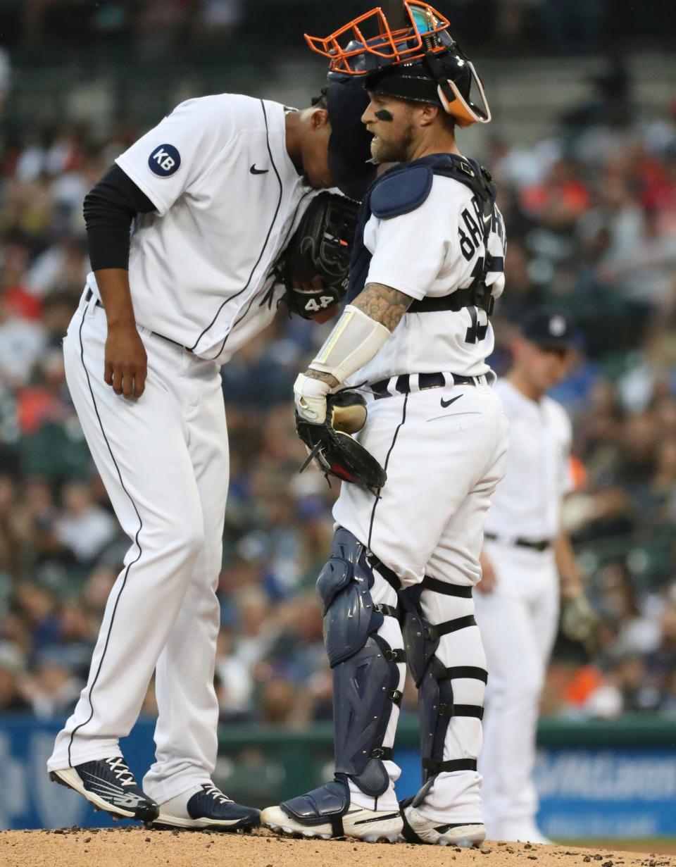 Detroit Tigers catcher Tucker Barnhart (15) talks to starter Elvin Rodriguez (45) during second inning action against the Toronto Blue Jays at Comerica Park in Detroit on Friday, June 10, 2022.