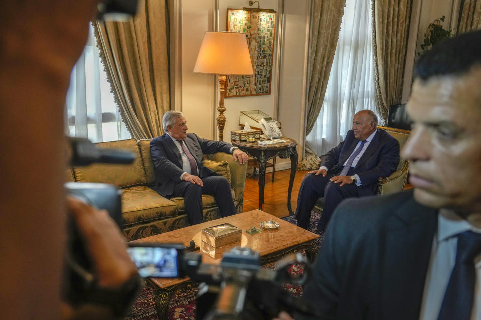 A security member stands alerts as photographers film Italian Foreign Minister Antonio Tajani meeting with his Egyptian counterpart Sameh Shoukry, right, in Cairo, Egypt, Wednesday, Oct. 11, 2023. (AP Photo/Amr Nabil)