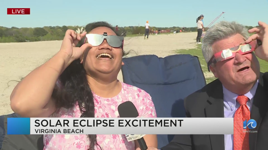 <em>WAVY’s Andy Fox watches the 2024 eclipse with Jessica from Samoa at Mount Trashmore in Virginia Beach (WAVY image) </em>