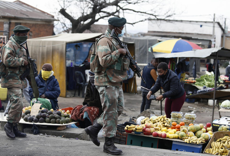 South African Defence Force soldiers on patrol in Alexandra Township, north of Johannesburg, Thursday, July 15 2021. The arm has begun deploying 25,000 troops to assist police in quelling the weeklong riots and violence sparked by the imprisonment of former President Jacob Zuma. (AP Photo)