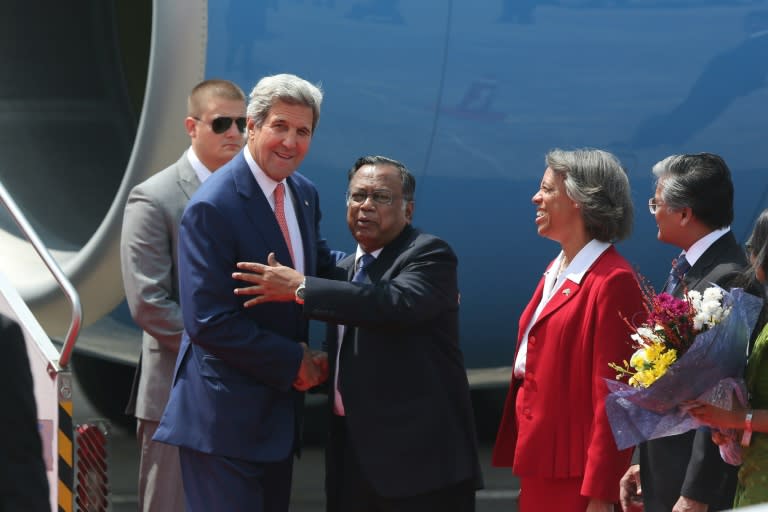 US Secretary of State John Kerry (L) is welcomed by Bangladesh counterpart Mahmood Ali as US ambassador to the country Marcia Bernicat (2nd R) looks on, following Kerry's arrival at Dhaka airport on August 29, 2016