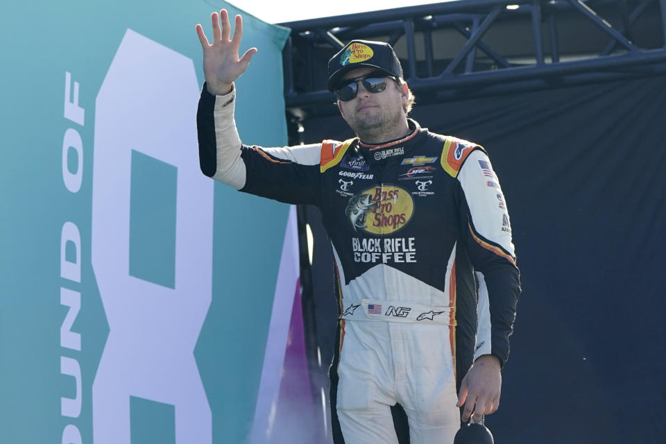Noah Gragson waves to the crowd before a NASCAR Xfinity Series auto race at Homestead-Miami Speedway, Saturday, Oct. 22, 2022, in Homestead, Fla. (AP Photo/Lynne Sladky)