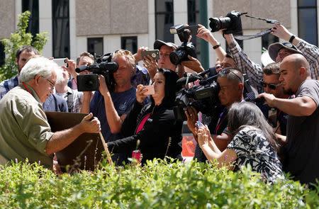 Jeff Kandyba, courtroom artist, shows his latest sketch outside Denver Federal Court where the Taylor Swift groping trial goes on, in Denver, Colorado, U.S. August 14, 2017. REUTERS/Rick Wilking