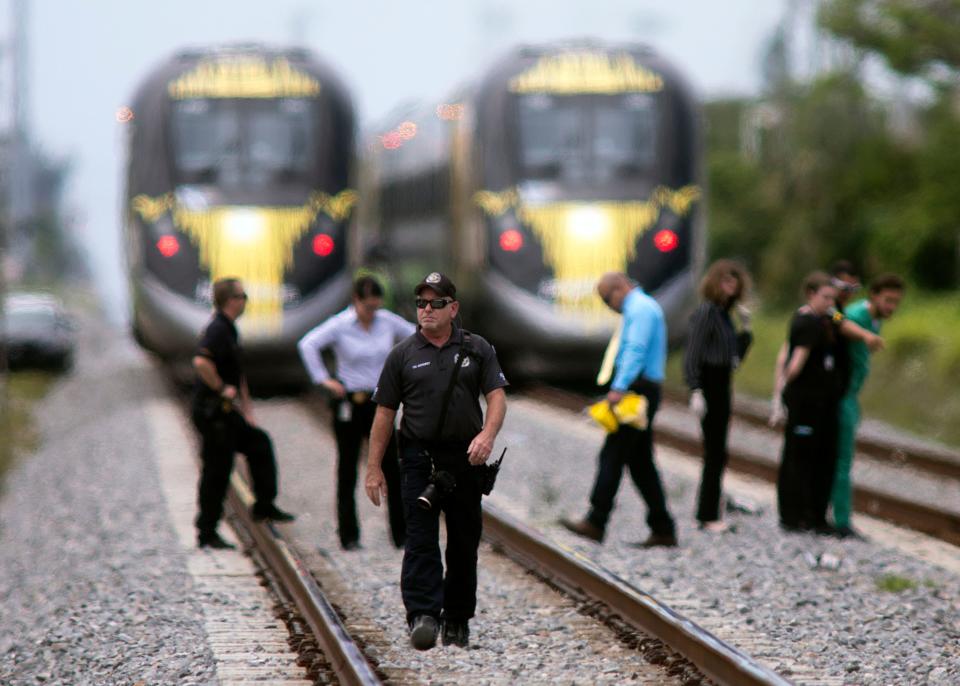 Police investigate a dead body on train tracks south of Woolbright Rd. that appears to have been struck by a Brightline train, in this photo circa  2018.