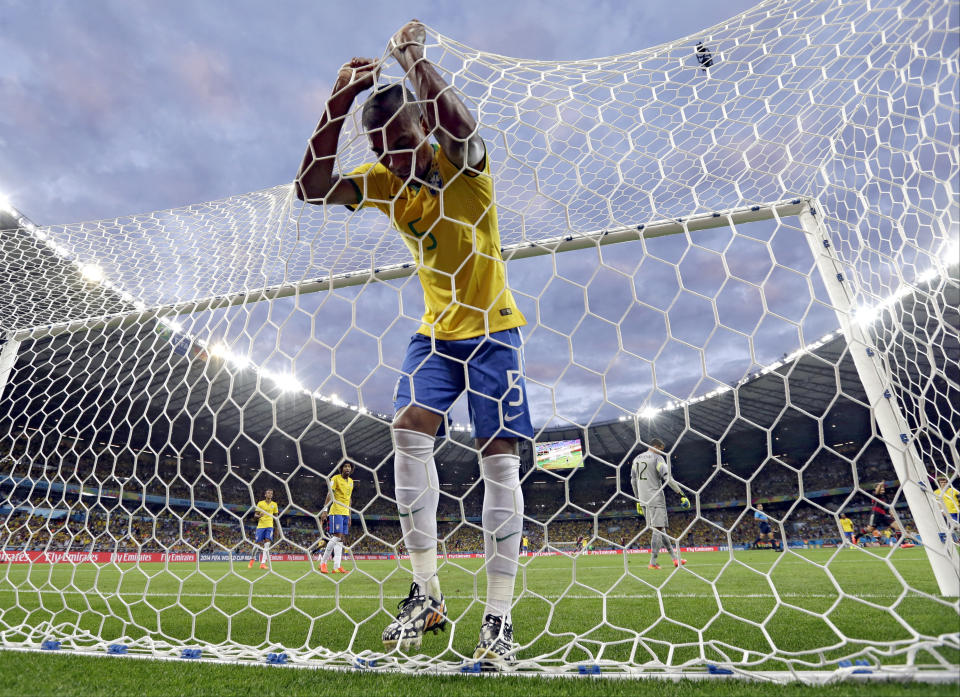 FILE - Brazil's Fernandinho reacts after Germany's Toni Kroos during scored his side's third goal during the World Cup semifinal soccer match between Brazil and Germany at the Mineirao Stadium in Belo Horizonte, Brazil, Tuesday, July 8, 2014. Germany won the match 7-1. (AP Photo/Natacha Pisarenko, File)