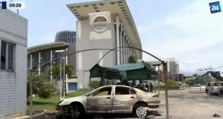 A still image from video of a fire damaged vehicle outside the national assembly building in Libreville, Gabon, September 2, 2016. GABON 24 TV/Handout via Reuters
