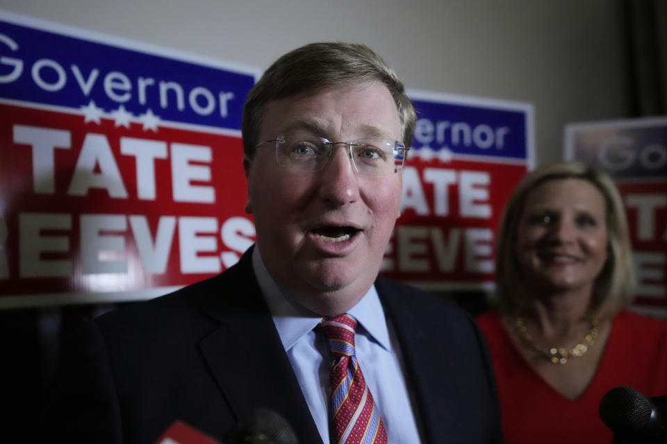 FILE - With wife Elee Reeves at his side, Mississippi Gov. Tate Reeves speaks in Jackson, Miss., after winning the Republican primary on Tuesday, Aug. 8, 2023. Records show Tate Reeves received a $10,000 campaign contribution from a shipping company executive in 2020, several days before the state announced incentives for a division of the company to expand its operation in Mississippi. (AP Photo/Rogelio V. Solis, File)