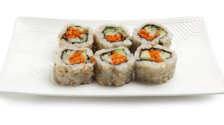Vegetable sushi on white plate