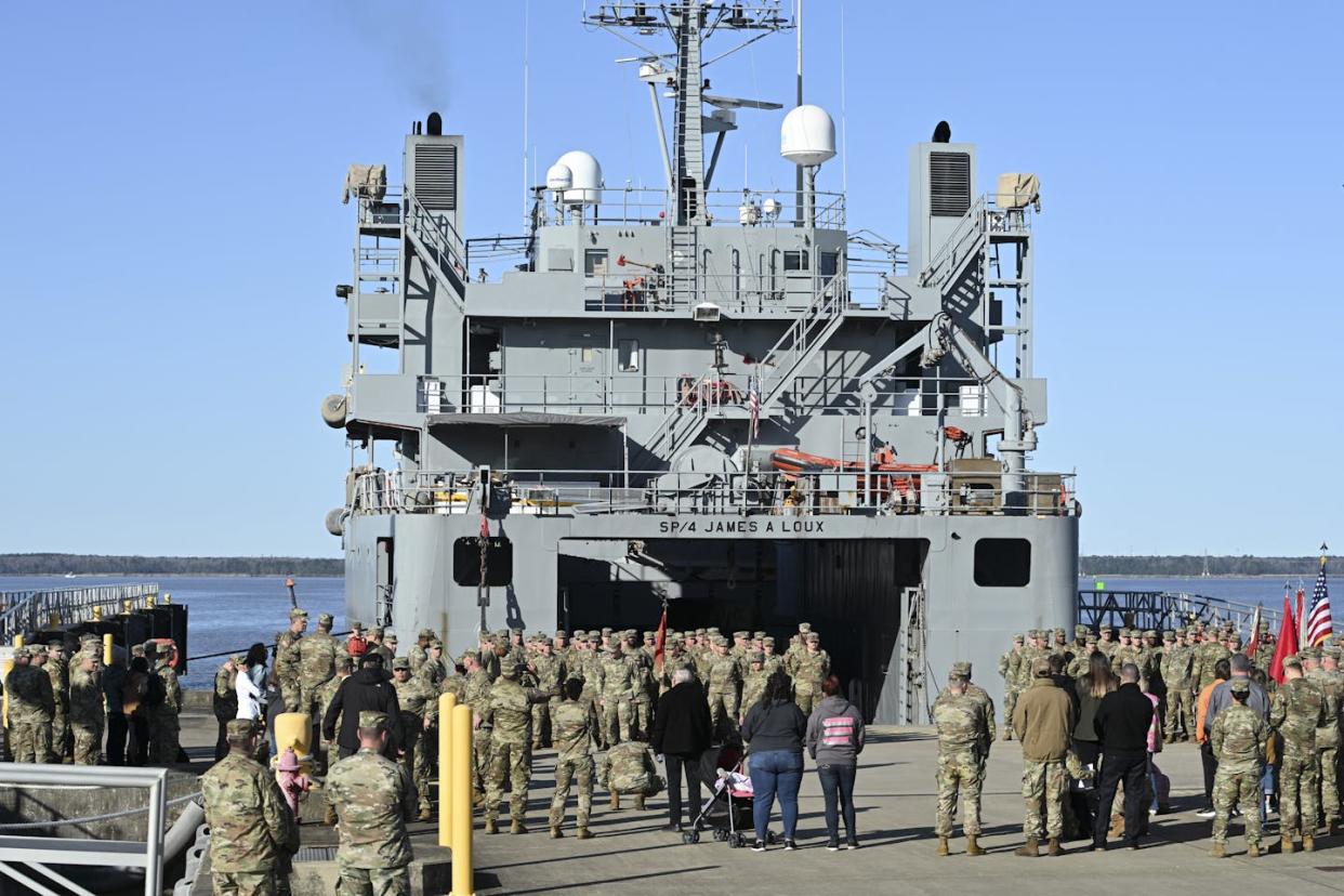 Crew members of the Army ship James A. Loux in Hampton, Va., prepare on March 12, 2024, for the ship to go to the Middle East to build the Gaza pier. <a href="https://www.gettyimages.com/detail/news-photo/crew-members-of-the-usav-sp4-james-a-loux-and-the-usav-news-photo/2071884919?adppopup=true" rel="nofollow noopener" target="_blank" data-ylk="slk:Roberto Schmidt/AFP via Getty Images;elm:context_link;itc:0;sec:content-canvas" class="link ">Roberto Schmidt/AFP via Getty Images</a>