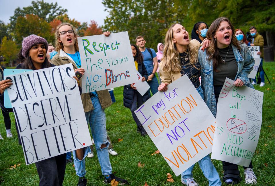 From left, Aanya Jain, Sam Dark, Sam Barber and Grace Sarrazin chant during the Hoosiers Against Sexual Assault demonstration Oct. 22, 2021, in Indiana University's Dunn Meadow.