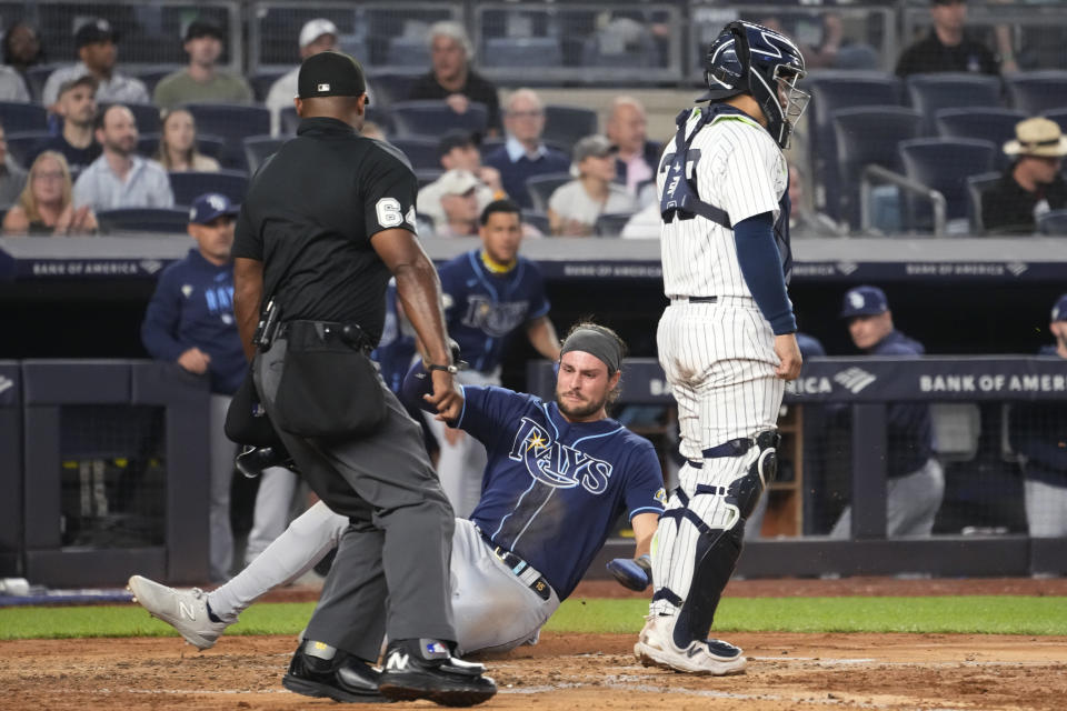 Tampa Bay Rays' Josh Lowe scores on a double by Yandy Diaz against the New York Yankees during the fifth inning of a baseball game Thursday, May 11, 2023, in New York. (AP Photo/Mary Altaffer)