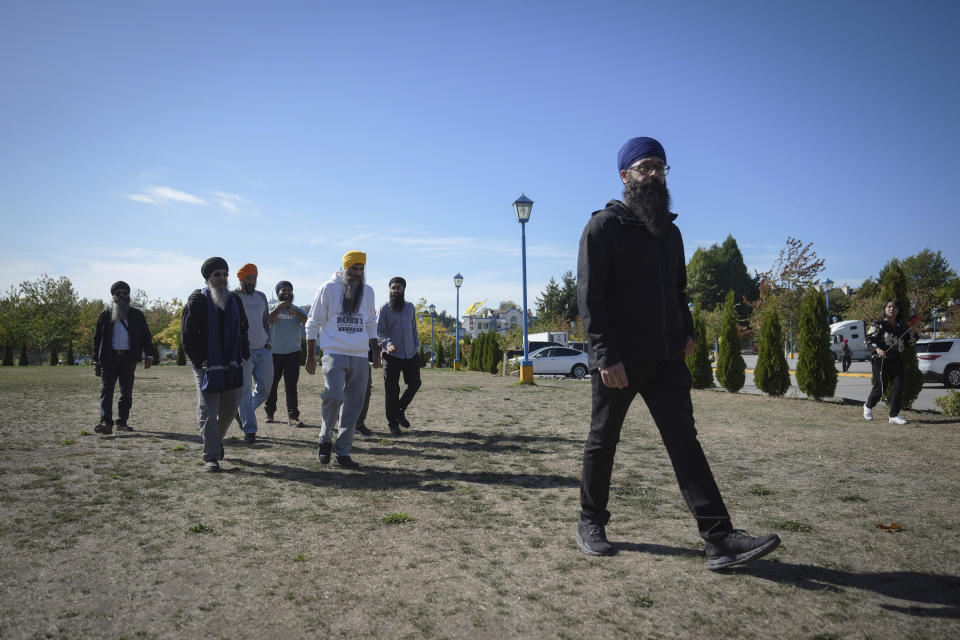 Moninder Singh, front right, a spokesperson for the British Columbia Gurdwaras Council (BCGC), prepares to speak to reporters outside the Guru Nanak Sikh Gurdwara Sahib in Surrey, British Columbia, on Monday, Sept. 18, 2023, where temple president Hardeep Singh Nijjar was gunned down in his vehicle while leaving the temple parking lot in June. Canada expelled a top Indian diplomat Monday as it investigates what Prime Minister Justin Trudeau called credible allegations that India’s government may have had links to the assassination in Canada of a Sikh activist.(Darryl Dyck/The Canadian Press via AP)