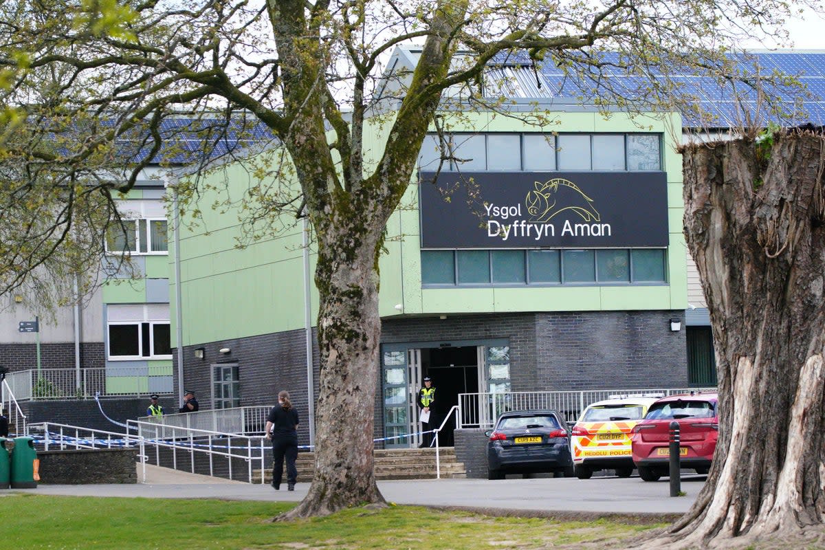 Police at Amman Valley school, in Ammanford, Carmarthenshire (PA Wire)