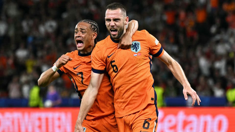 Stefan de Vrij (right) celebrates with his teammate Xavi Simons after scoring the Netherlands' first goal against Turkey. - Javier Soriano/AFP/Getty Images