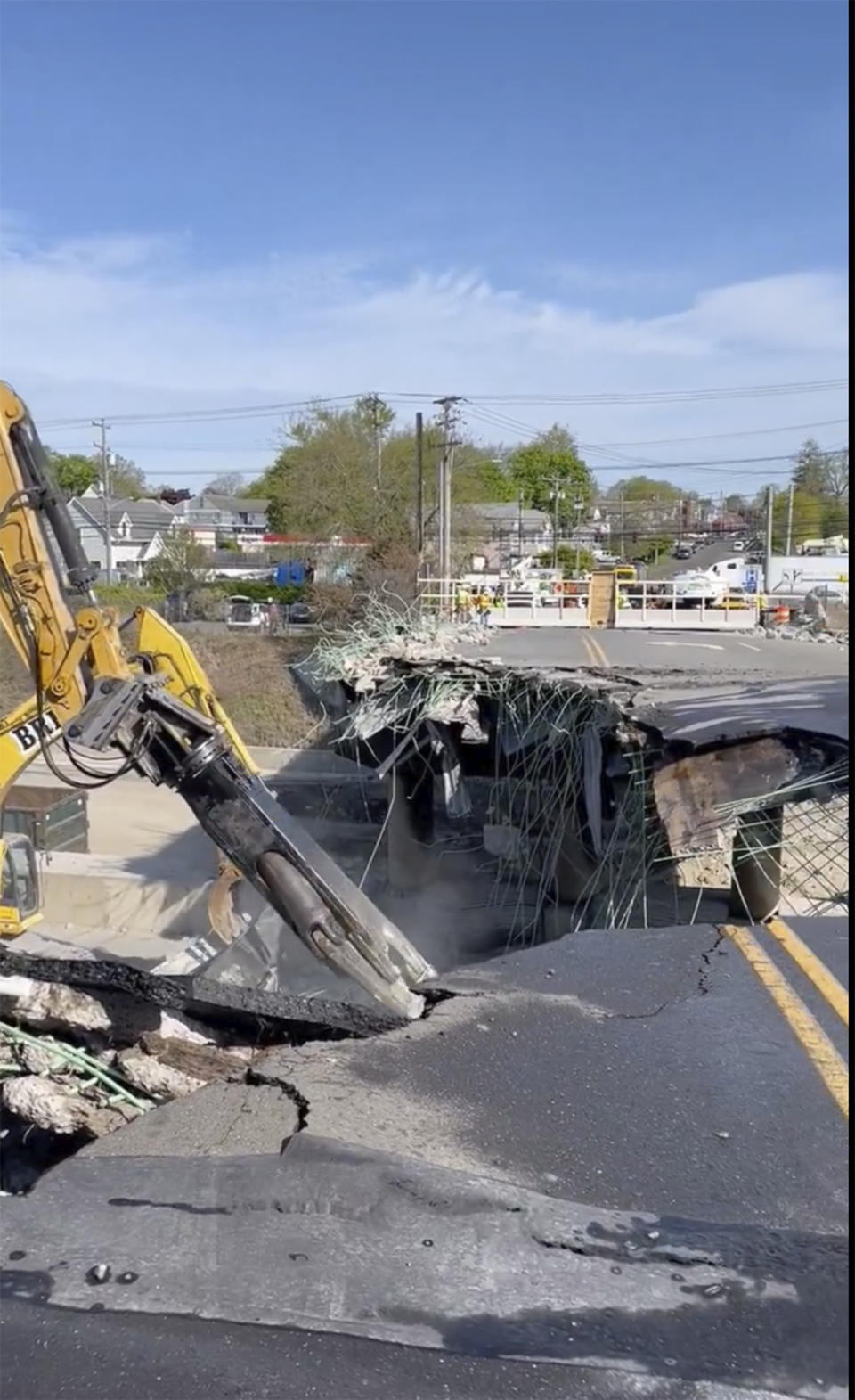 This photo provided by Norwalk, Conn. Police Dept., construction crews continue demolishing the Fairfield Avenue overpass early Saturday, May 4, 2024 in Norwalk, Conn. The bridge damaged in a fiery crash that kept Interstate 95 in Connecticut closed Thursday and Friday has been demolished. (Norwalk, Conn. Police Dept via AP)