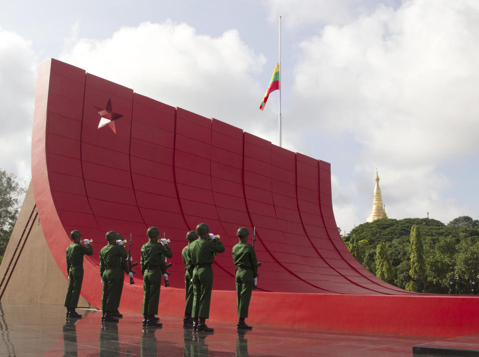 Soldiers stand in attention during a ceremony to mark the 72nd anniversary of the 1947 assassination of independence heroes including Gen. Aung San, the late father of Myanmar leader Aung San Suu Kyi, Friday, July 19, 2019, in Yangon, Myanmar. The country's Independence hero Gen. Aung San and his cabinet were gunned down in 1947. (AP Photo/Thein Zaw)