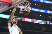 Dallas Mavericks guard Josh Green dunks during the first half of an NBA basketball game against the Los Angeles Clippers Wednesday, Feb. 8, 2023, in Los Angeles. (AP Photo/Mark J. Terrill)