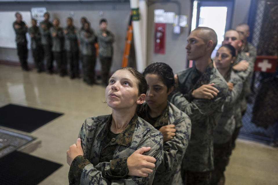 A group of U.S. Marine Corps recruits wait inline before jumping into the water during swim training at the Marine Corps Recruit Depot pool, Wednesday, June 28, 2023, in Parris Island, S.C. (AP Photo/Stephen B. Morton)