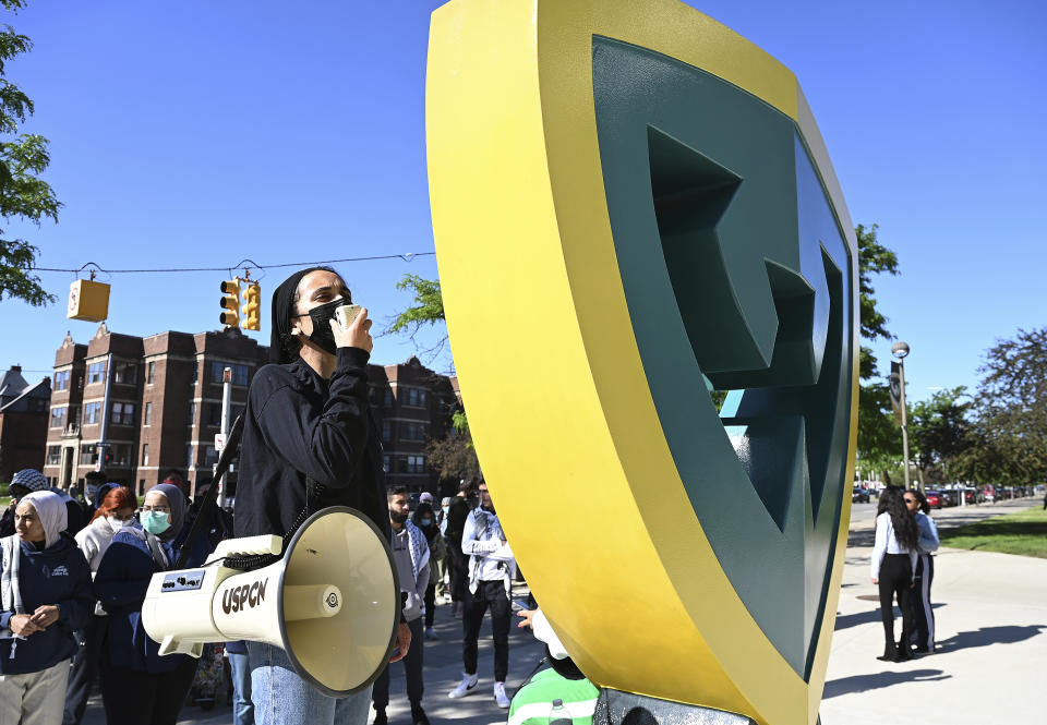 Pro-Palestinian protesters yell and chant at WSU Police officers during a rally on Gullen Mall after the police broke up the encampment and set up a perimeter around the campus on Thursday, May 30, 2024 in Detroit. (Clarence Tabb, Jr./Detroit News via AP)