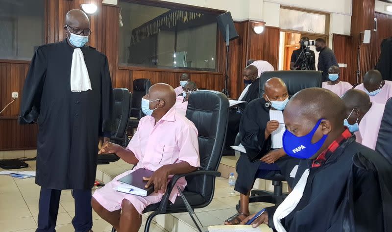 Paul Rusesabagina, portrayed as a hero in a Hollywood movie about Rwanda's 1994 genocide, talks to his lawyer Gatera Gashabana inside the courtroom in Kigali