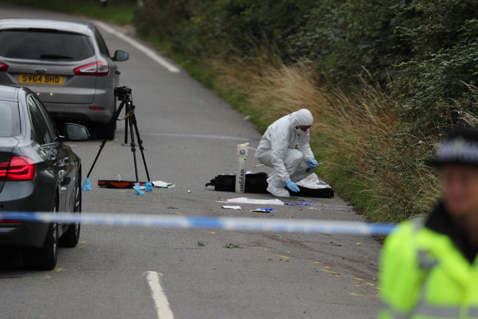 A police investigator at the scene of an incident, near Sulhamstead, Berkshire, where a Thames Valley Police officer was killed whilst attending a reported burglary on Thursday evening.