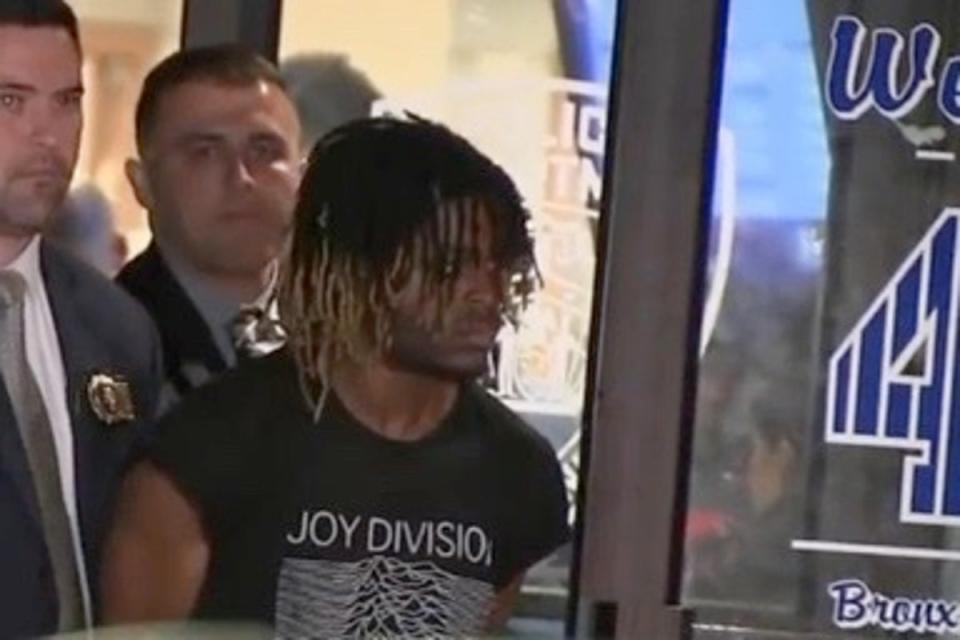 Damion Comager in handcuffs after he was charged with murder (ABC7)