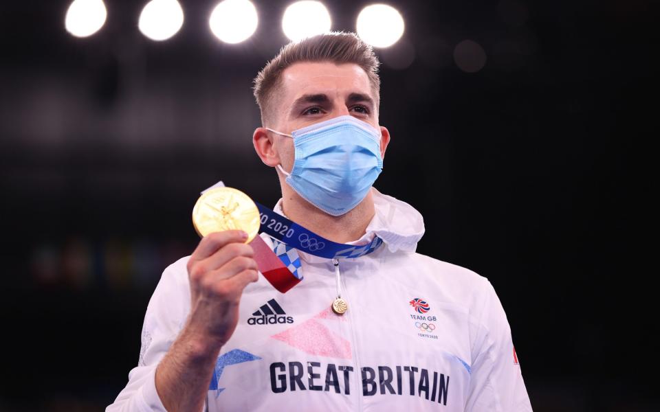 Max Whitlock stands atop the podium - GETTY IMAGES