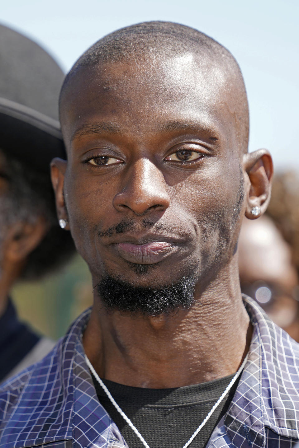 Michael Corey Jenkins listens as his legal team call on a federal judge Monday, March 18, 2024, at a news conference in Jackson, Miss., to impose the harshest possible penalties against six former Mississippi Rankin County law enforcement officers who committed numerous acts of racially motivated, violent torture on him and a friend, Eddie Terrell Parker in 2023. The six former law officers pleaded guilty to a number of charges for torturing them and sentencing for the six starts on Tuesday. (AP Photo/Rogelio V. Solis)