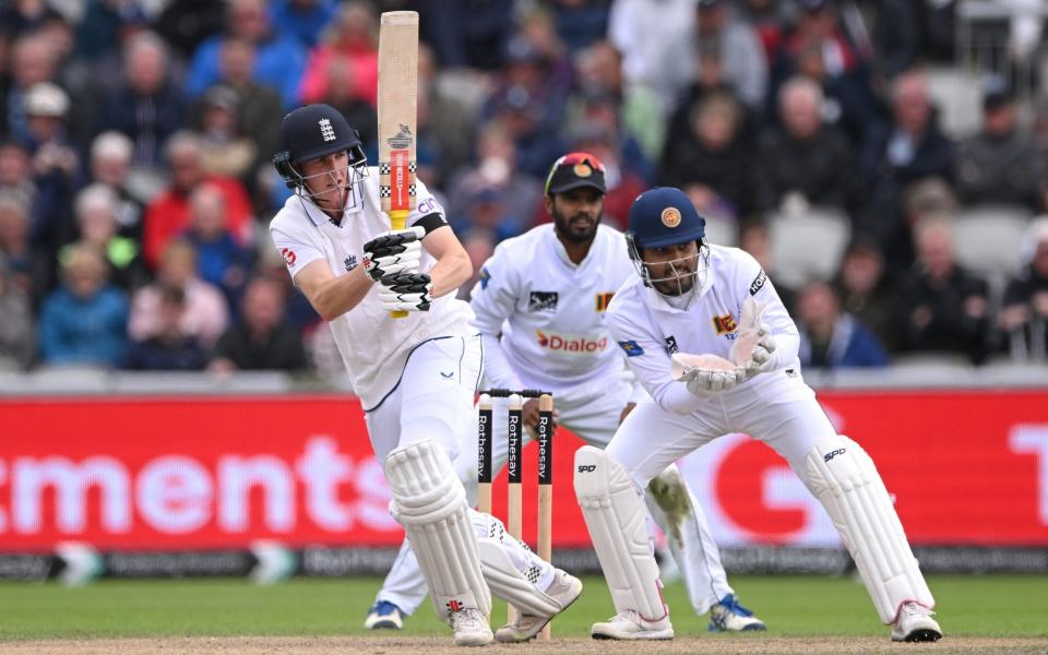 England batsman Harry Brook picks up runs watched by wicketkeeper Dinesh Chandimal during day two of the First Test Match between England and Sri Lanka at Emirates Old Trafford on August 22, 2024 in Manchester, England