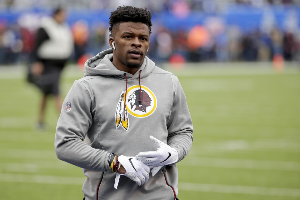 FILE - In this Oct. 28, 2018, file photo, then-Washington Redskins running back Chris Thompson (25) warms up before an NFL football game against the New York Giants in East Rutherford, N.J. Reporters from The Associated Press spoke to more than two dozen athletes from around the globe -- representing seven countries and 11 sports -- to get a sense of how concerned or confident they are about resuming competition. Thompson is an NFL running back. He’s also the father of a 4-month-old daughter, Kali. “If I go practice or play and I come back home with the virus, she’s not strong enough yet to fight something like that. For me, that’s my biggest worry,” said Thompson, who signed with the Jacksonville Jaguars this month after seven seasons with the Redskins. (AP Photo/Seth Wenig, File)