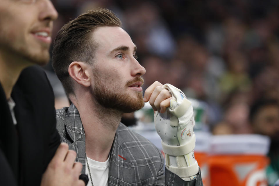 Injured Boston Celtics player Gordon Hayward watches from the bench during the second quarter of the team's NBA basketball game against the Washington Wizards on Wednesday, Nov. 13, 2019, in Boston. (AP Photo/Winslow Townson)