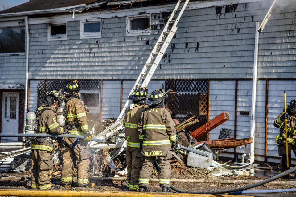 Firefighters work the scene of a blaze in Jamestown in 2021.