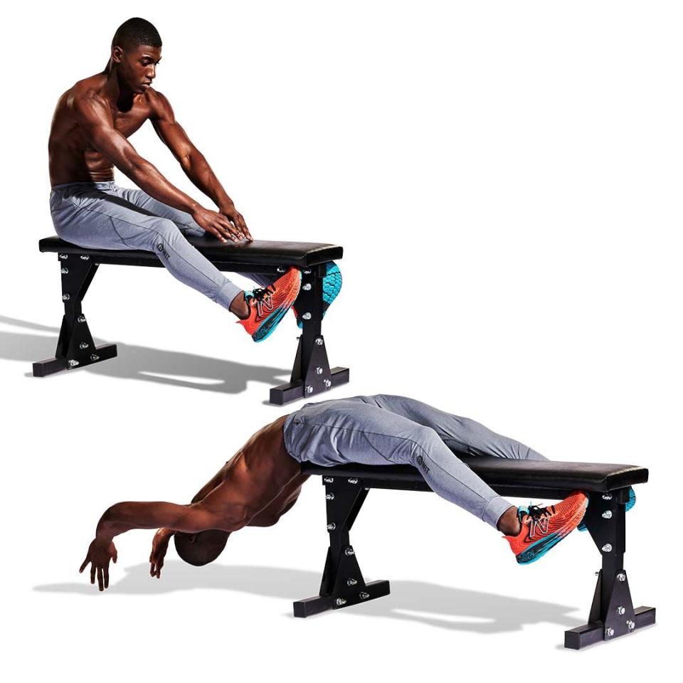 <p>Sit with a bench between your legs (<strong>A</strong>), your hands stretched out in front of you. Lower yourself backwards until your upper body is off the bench. Touch the ground behind your head (<strong>B</strong>) before engaging your core to sit back up again.<br></p>
