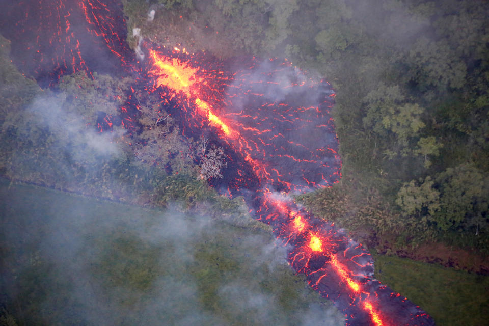 Lava erupts from a fissure east of the Leilani Estates subdivision during ongoing eruptions&nbsp;on May 13, 2018.&nbsp;