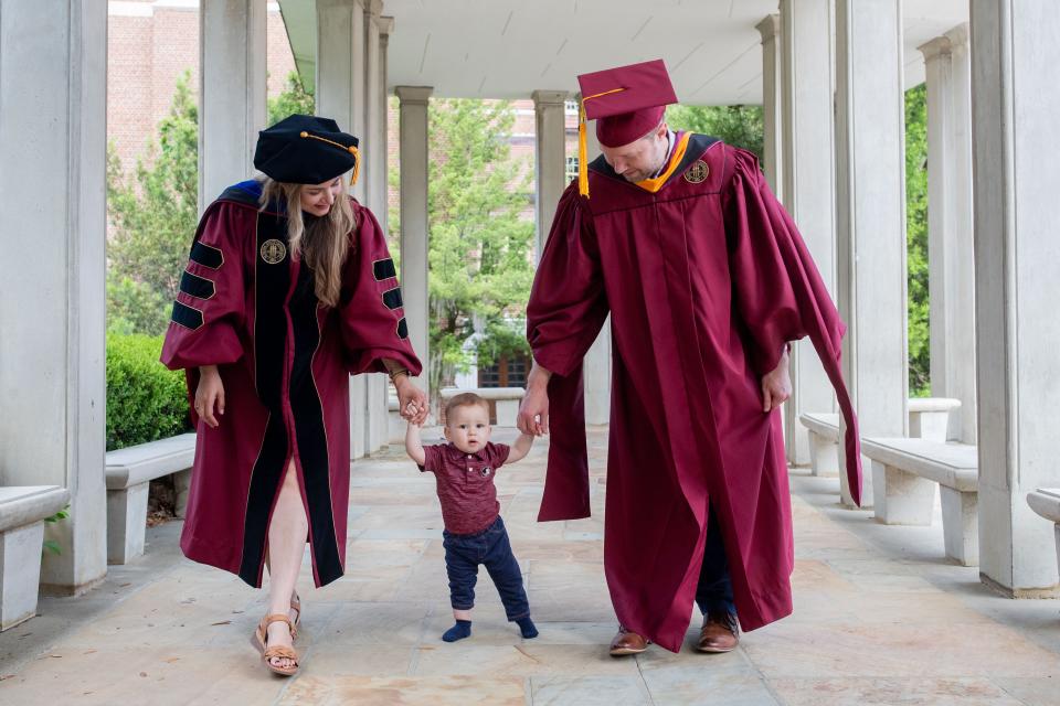 Rachel and Josh Duke spend time with their son, Arthur, on the Florida State University campus on Tuesday, April 30, 2024. The couple is ending their time at FSU with two degrees, a dissertation and a baby after a challenging few years.