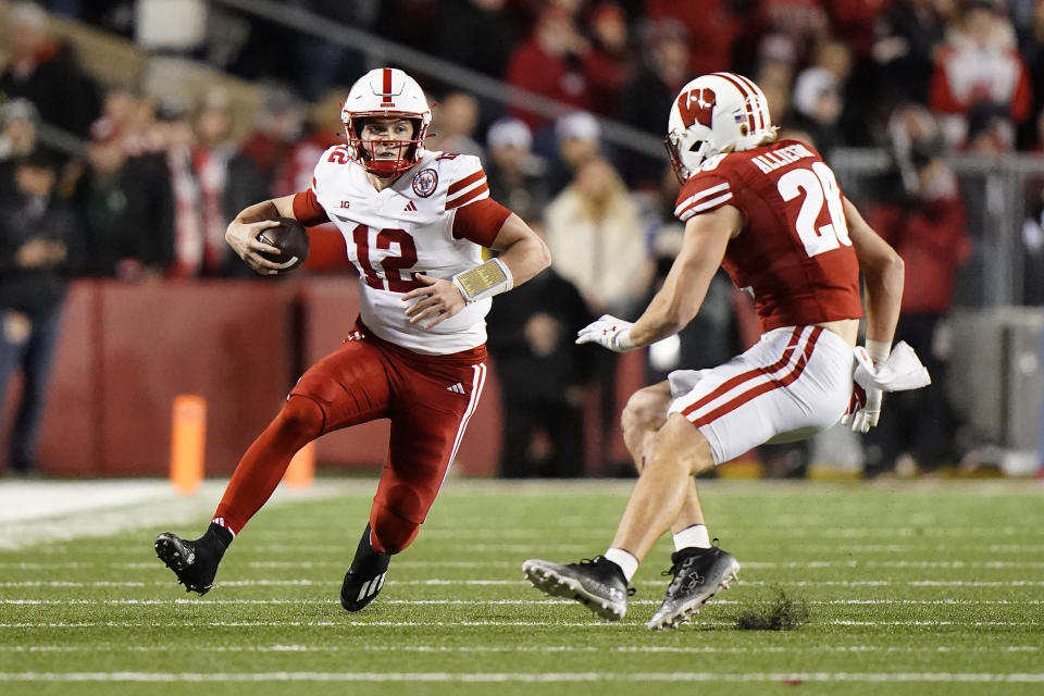 Nebraska's Chubba Purdy (12) runs against Wisconsin's Christian Alliegro during the second half of an NCAA college football game Saturday, Nov. 18, 2023 in Madison, Wis. (AP Photo/Aaron Gash)