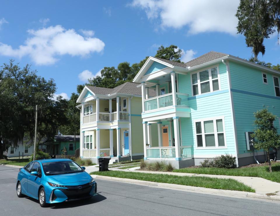 A motorist drives past multi-family housing off Northwest First Street in Gainesville's Pleasant Street. The city of Gainesville voted Aug. 4 to eliminate single-family zoning citywide, the first of two voters needed to make the change.