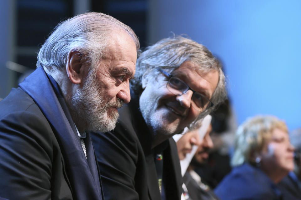 State Academic Mariinsky Theatre Artistic and General Director Valery Gergiev, left, and Serbia's Film Director and Musician Emir Kusturica attend a plenary session of the IX International Cultural Forum - Forum of United Cultures in St. Petersburg, Russia, Friday, Nov. 17, 2023. (Mikhail Metzel, Sputnik, Kremlin Pool Photo via AP)