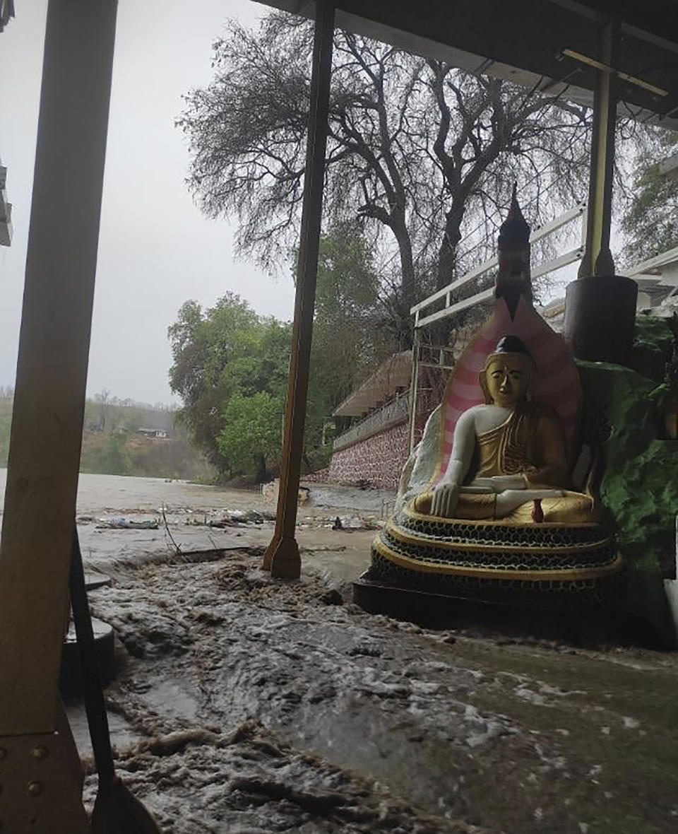 In this photo provided by Myanmar Military True News Information Team on Monday, May 15, 2023, a flooded area caused by Cyclone Mocha is seen near Mann Shwe Sat Taw pagoda in Magwe Division, central Myanmar. Rescuers early Monday evacuated about 1,000 people trapped by seawater 3.6 meters (12 feet ) deep along western Myanmar's coast after the powerful cyclone injured hundreds and cut off communications. (Military True News Information Team via AP)