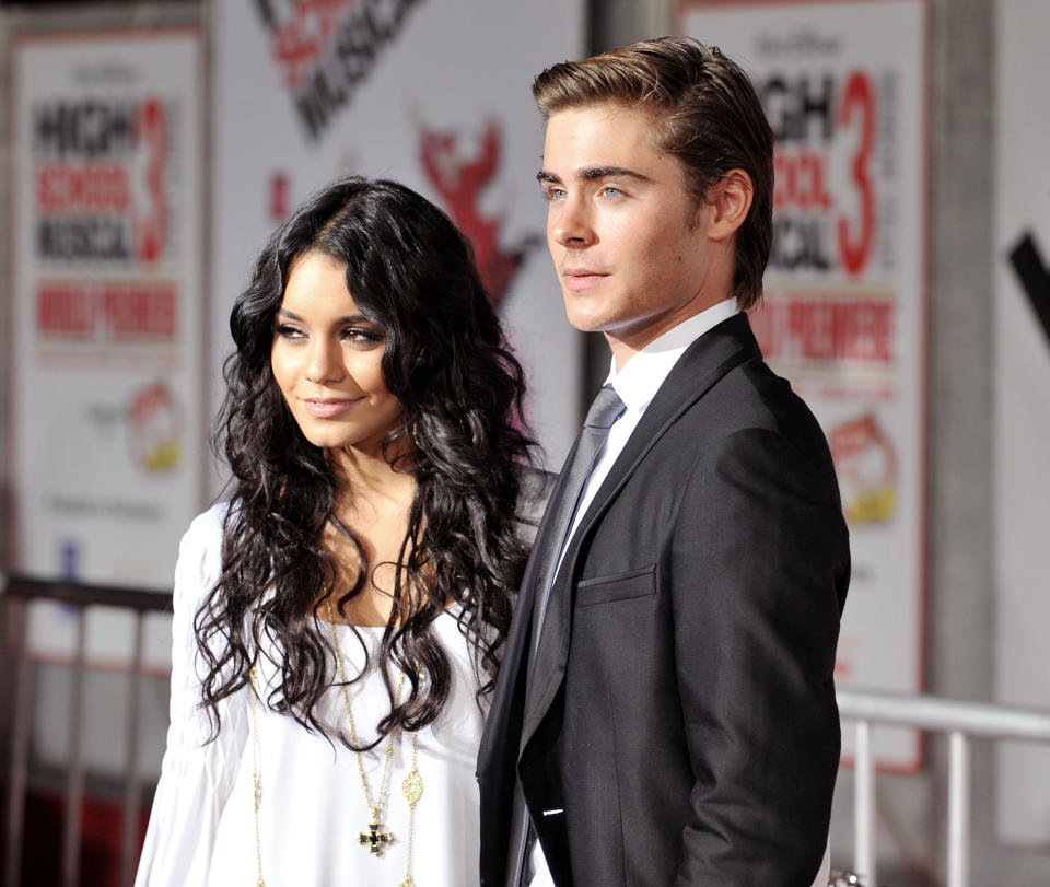 Vanessa Hudgens in a white dress and Zac Efron in a dark suit at the High School Musical 3 premiere