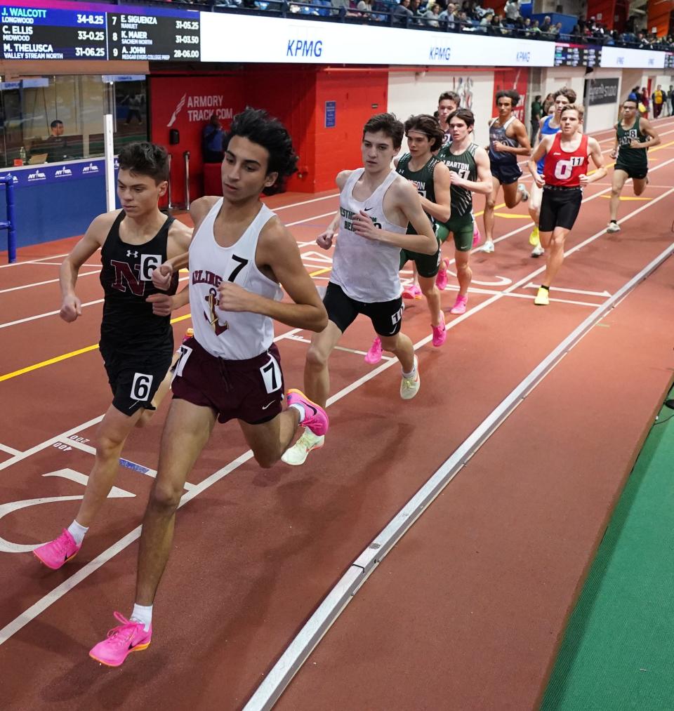 Nyack's Matt Schutzbank, left, and Arlington's Ethan Green run the invitational mile at the Millrose Trials at The Armory in New York on Wednesday, January 11, 2023.